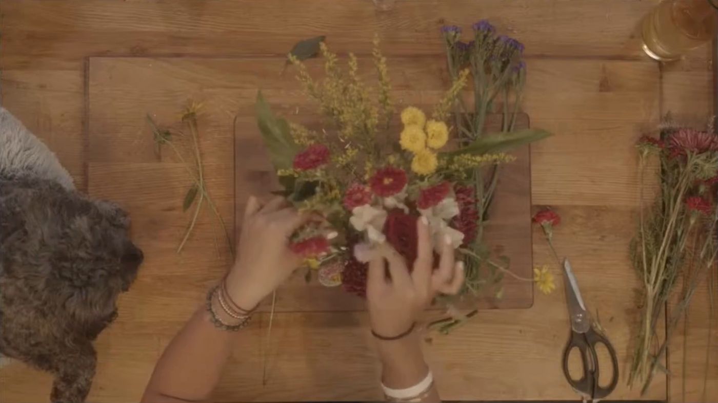 A florist arranging a bouquet